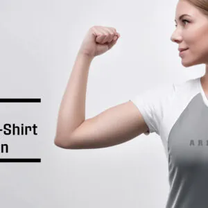 gym t-shirt for women.Athletic woman wearing Arnold Gym Bold Series t-shirt, performing a workout in breathable, slim-fit gymwear designed for women.